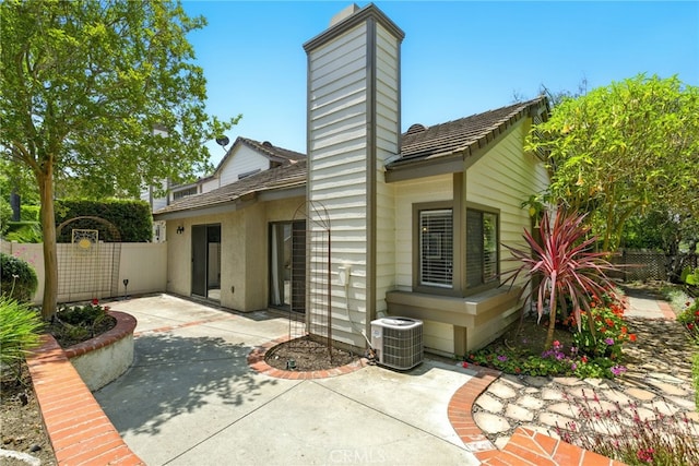 24571 Camden Ct, Laguna Niguel, CA 92677 - back of property featuring a chimney and a patio