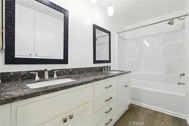 24571 Camden Ct, Laguna Niguel, CA 92677 - full bathroom with washtub / shower combination, wood finished floors, and double vanity