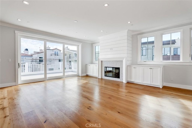 1100 Cypress Ave, Hermosa Beach, CA 90254 - unfurnished living room with light wood-style floors, a glass covered fireplace, ornamental molding, and recessed lighting