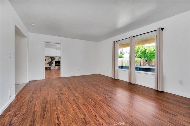 5495 N Callisch Ave, Fresno, CA 93710 - spare room featuring wood finished floors