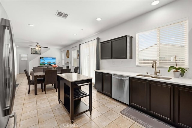 3660 Half Dome Ave, Rosamond, CA 93560 - kitchen featuring stainless steel appliances, ceiling fan, light tile patterned floors, light countertops, and recessed lighting