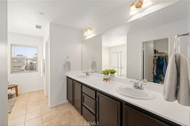 3660 Half Dome Ave, Rosamond, CA 93560 - full bathroom featuring double vanity, plenty of natural light, and tile patterned flooring