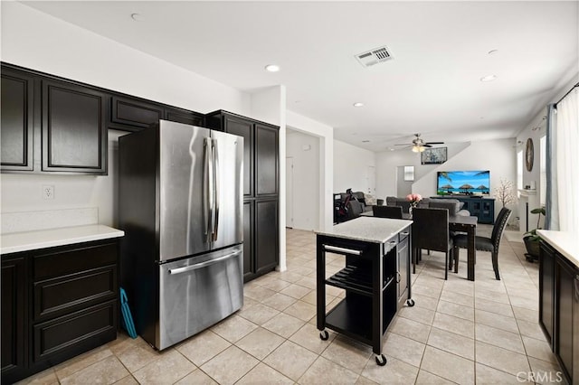 3660 Half Dome Ave, Rosamond, CA 93560 - kitchen featuring freestanding refrigerator, dark cabinets, ceiling fan, light countertops, and recessed lighting