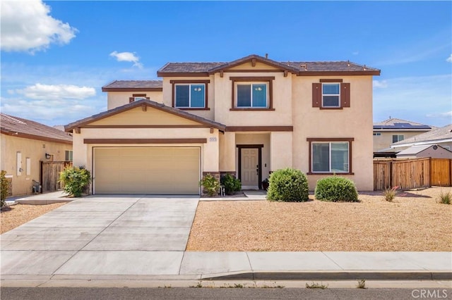 3660 Half Dome Ave, Rosamond, CA 93560 - view of front facade with stucco siding, concrete driveway, and an attached garage