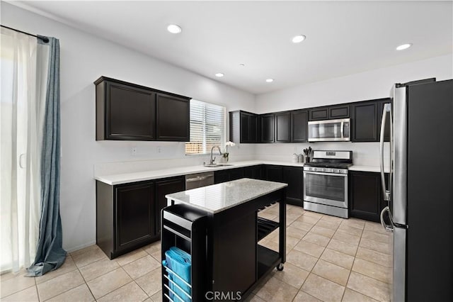 3660 Half Dome Ave, Rosamond, CA 93560 - kitchen featuring appliances with stainless steel finishes, light tile patterned floors, recessed lighting, and light countertops