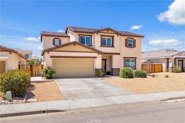 3660 Half Dome Ave, Rosamond, CA 93560 - traditional home featuring stucco siding, concrete driveway, a garage, and stone siding