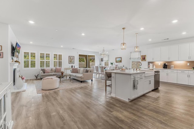 566 Purple Sage Ln, Simi Valley, CA 93065 - kitchen featuring stainless steel dishwasher, open floor plan, recessed lighting, white cabinets, and backsplash