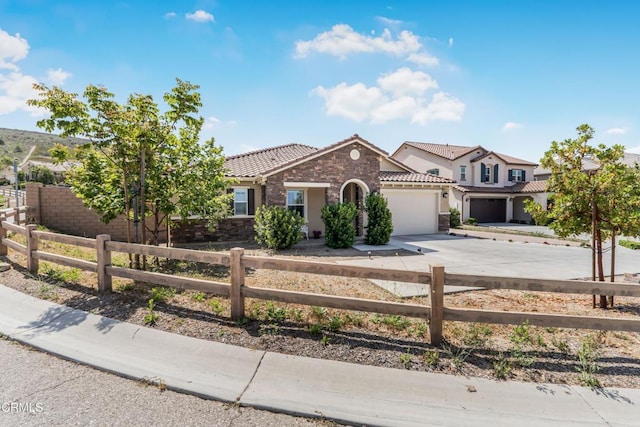 566 Purple Sage Ln, Simi Valley, CA 93065 - view of front facade with a tiled roof, a fenced front yard, concrete driveway, and an attached garage