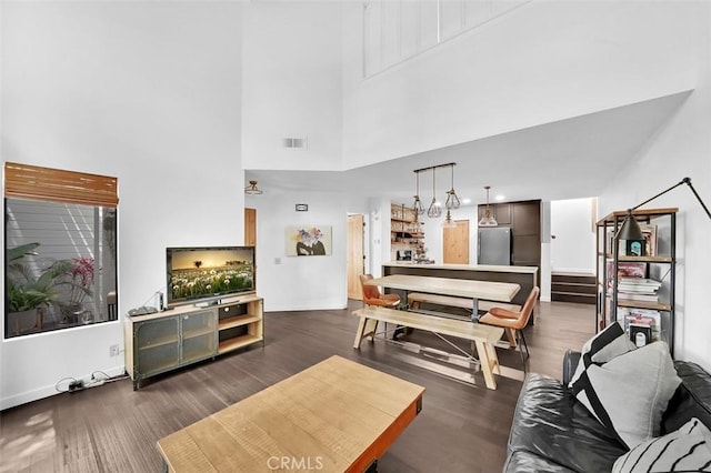 645 Springbrook, Irvine, CA 92614 - living area with a towering ceiling and dark wood finished floors