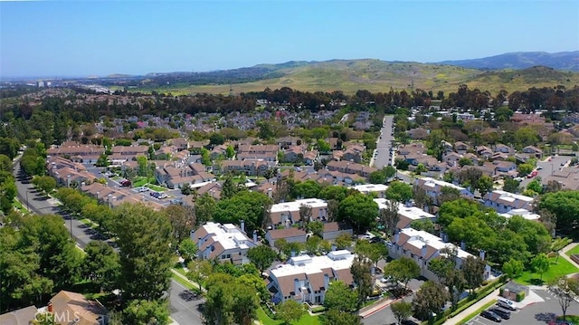 645 Springbrook N Unit 21, Irvine, CA 92614 - aerial view of property and surrounding area featuring mountains and nearby suburban area