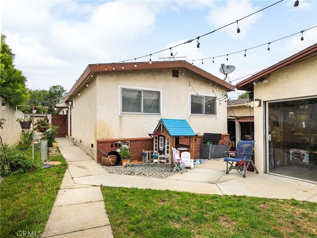 512 Lomita St, El Segundo, CA 90245 - back of house with stucco siding, a patio area, and crawl space