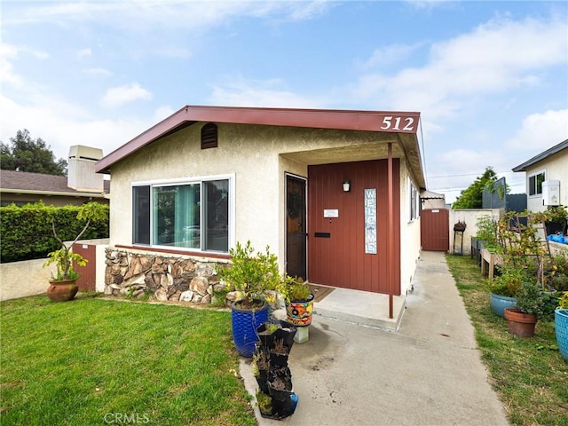 512 Lomita St, El Segundo, CA 90245 - bungalow-style house featuring stucco siding and stone siding