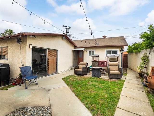 512 Lomita St, El Segundo, CA 90245 - rear view of property with outdoor lounge area, stucco siding, a patio, and a fenced backyard