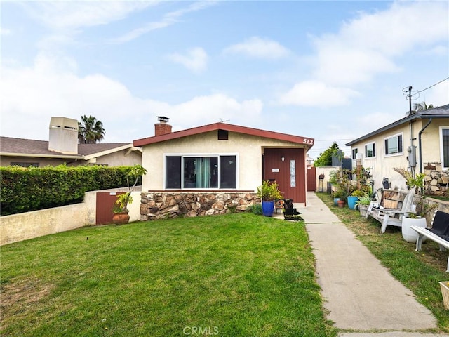 512 Lomita St, El Segundo, CA 90245 - view of front of property featuring a chimney, stone siding, and stucco siding