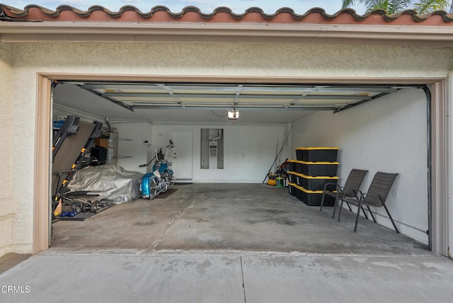 1306 Bluejay St, Fillmore, CA 93015 - garage with a garage door opener and secured water heater