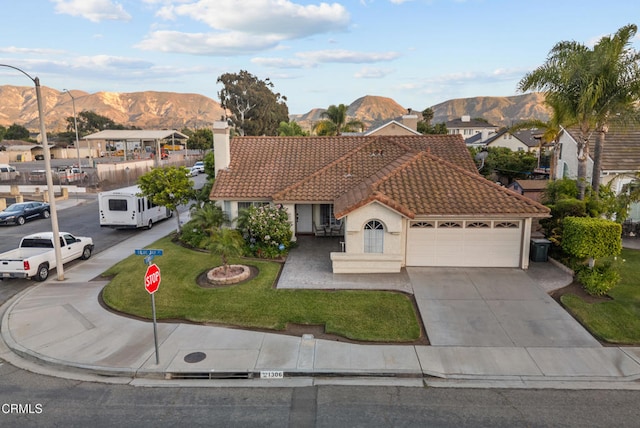 1306 Bluejay St, Fillmore, CA 93015 - view of front of property with a tile roof, a mountain view, an attached garage, and a chimney