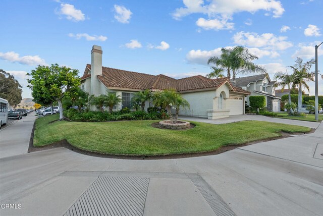 1306 Bluejay St, Fillmore, CA 93015 - view of front facade with a tile roof, stucco siding, an attached garage, a front yard, and a chimney