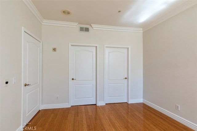 7218 Hillside Ave Unit 202, Los Angeles, CA 90046 - unfurnished bedroom featuring ornamental molding and light wood-style flooring