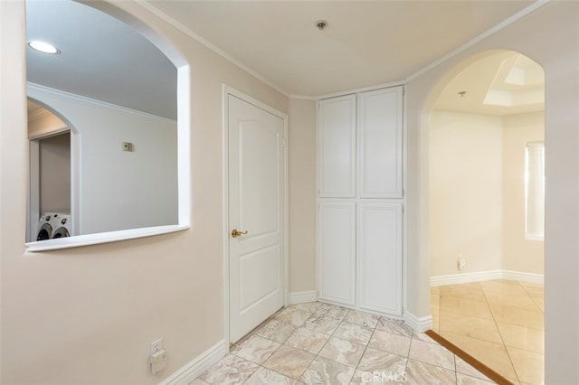 7218 Hillside Ave Unit 202, Los Angeles, CA 90046 - hallway with washer / dryer, recessed lighting, arched walkways, and ornamental molding