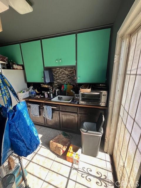 3804 Broadway Unit 3804, Huntington Park, CA 90255 - kitchen featuring light tile patterned floors and tasteful backsplash