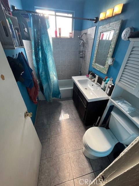 3804 Broadway Unit 3804, Huntington Park, CA 90255 - full bath featuring tile patterned flooring, shower / bathtub combination with curtain, and vanity