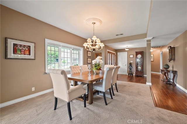 2082 Kaia Ln, Sierra Madre, CA 91024 - dining area featuring a chandelier, light wood-style floors, and ornate columns