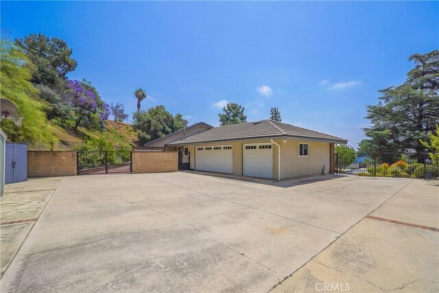 2082 Kaia Ln, Sierra Madre, CA 91024 - view of side of property featuring a tiled roof, a gate, and stucco siding