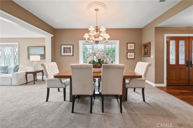 2082 Kaia Ln, Sierra Madre, CA 91024 - carpeted dining space with a chandelier and wood finished floors
