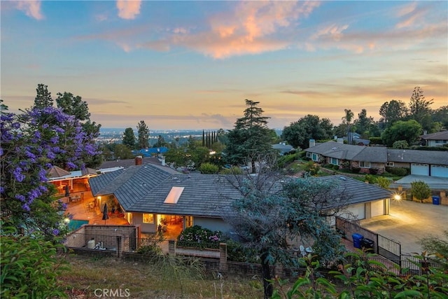 2082 Kaia Ln, Sierra Madre, CA 91024 - back of house at dusk featuring a garage and stucco siding