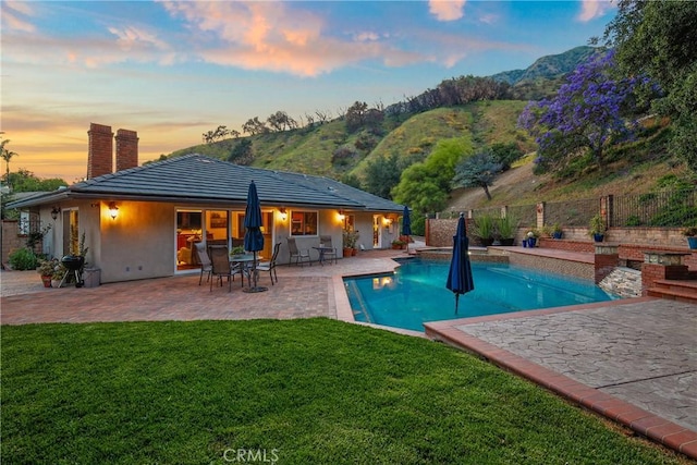 2082 Kaia Ln, Sierra Madre, CA 91024 - back of property featuring a chimney, a fenced backyard, a patio area, and a mountain view