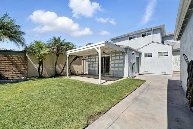 2275 Ximeno Ave, Long Beach, CA 90815 - back of property featuring a patio area, a yard, and stucco siding