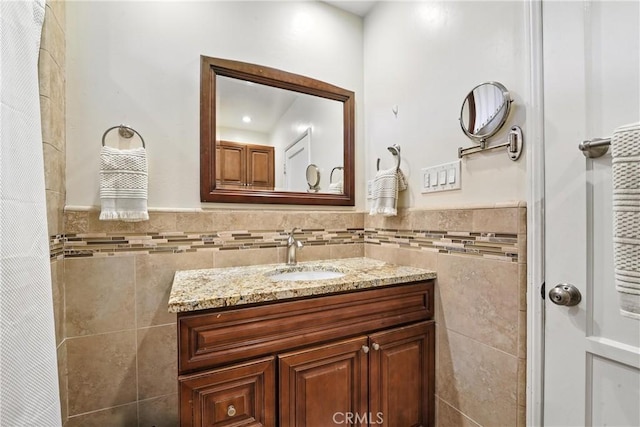2275 Ximeno Ave, Long Beach, CA 90815 - bathroom featuring tile walls, vanity, and a wainscoted wall
