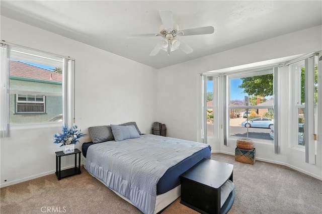 2275 Ximeno Ave, Long Beach, CA 90815 - carpeted bedroom featuring multiple windows and ceiling fan