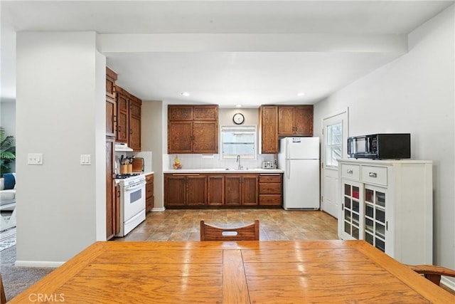 2275 Ximeno Ave, Long Beach, CA 90815 - kitchen with white appliances, light countertops, recessed lighting, and exhaust hood