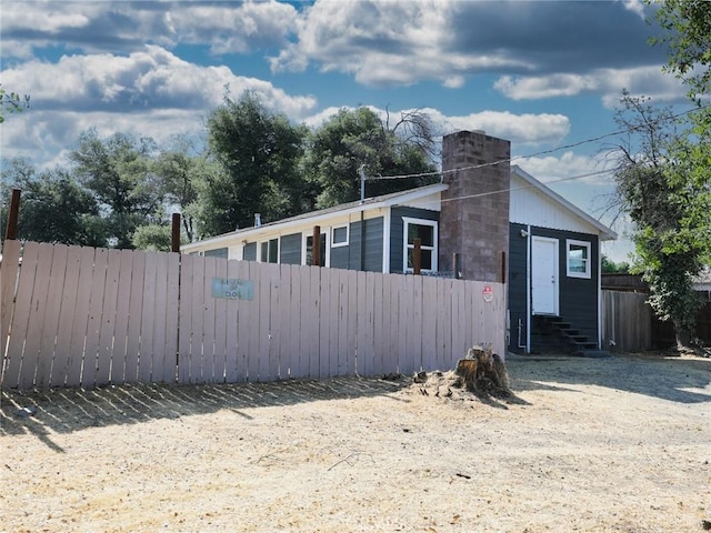 3450 10th St, Clearlake, CA 95422 - view of front of house featuring entry steps and a chimney