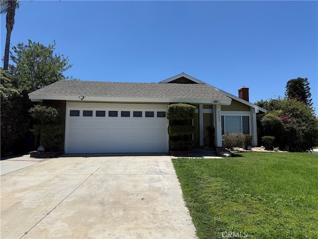 7293 Macy Ct, Riverside, CA 92503 - ranch-style home with concrete driveway, an attached garage, a front yard, and a chimney