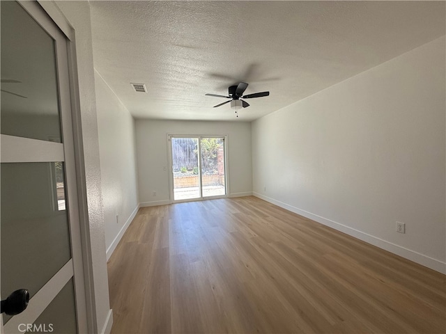 7293 Macy Ct, Riverside, CA 92503 - spare room with ceiling fan, light wood-style flooring, and a textured ceiling