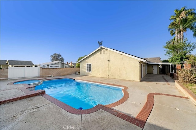 7293 Macy Ct, Riverside, CA 92503 - view of swimming pool featuring a patio area, a fenced backyard, and a pool with connected hot tub