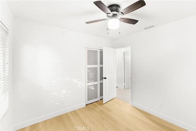 7293 Macy Ct, Riverside, CA 92503 - unfurnished bedroom featuring light wood-style floors and a ceiling fan
