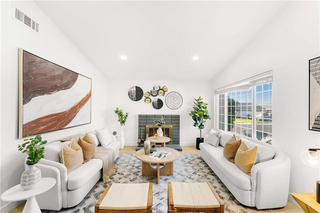 7293 Macy Ct, Riverside, CA 92503 - living area with lofted ceiling, recessed lighting, a fireplace, and wood finished floors