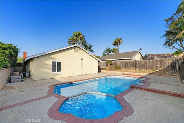 7293 Macy Ct, Riverside, CA 92503 - view of swimming pool featuring a patio area, a fenced backyard, and a pool with connected hot tub