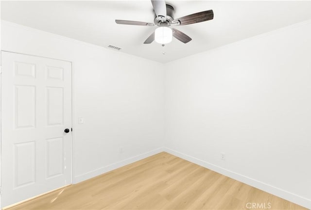 7293 Macy Ct, Riverside, CA 92503 - unfurnished room featuring light wood-style floors, a ceiling fan, and ornamental molding