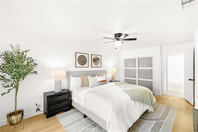 7293 Macy Ct, Riverside, CA 92503 - bedroom with light wood-type flooring and ceiling fan