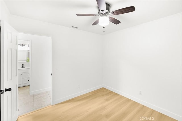 7293 Macy Ct, Riverside, CA 92503 - unfurnished room featuring ceiling fan, light wood-style floors, and ornamental molding