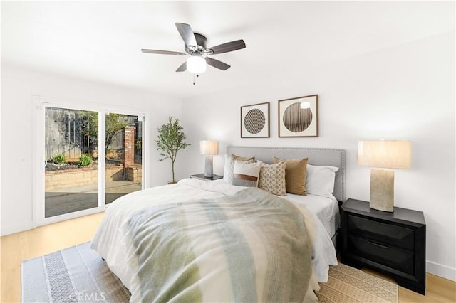 7293 Macy Ct, Riverside, CA 92503 - bedroom featuring access to exterior, wood finished floors, and a ceiling fan