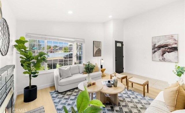 7293 Macy Ct, Riverside, CA 92503 - living area with recessed lighting, wood finished floors, and high vaulted ceiling