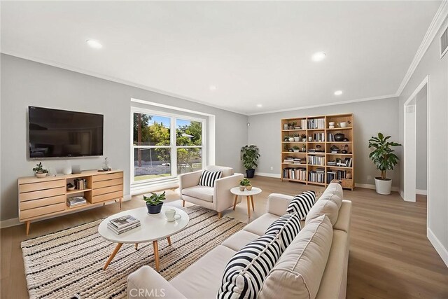 1141 N Palm St, La Habra, CA 90631 - living area featuring wood finished floors, crown molding, and recessed lighting