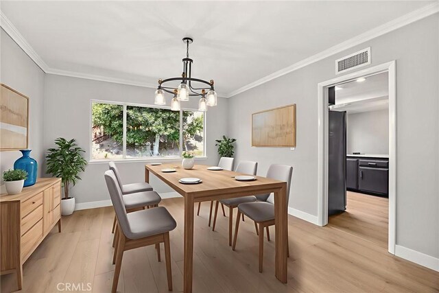 1141 N Palm St, La Habra, CA 90631 - dining area with a chandelier, ornamental molding, and light wood-style floors