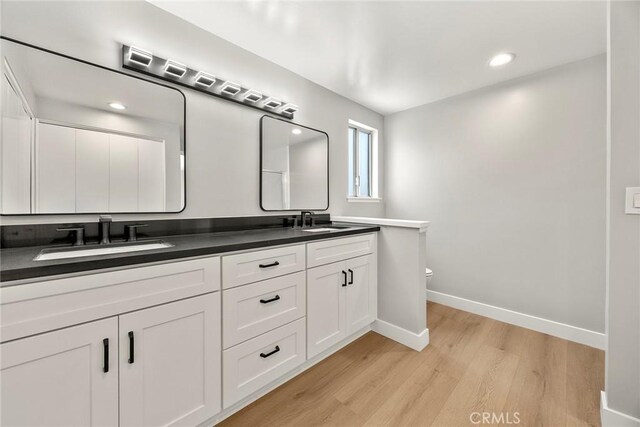 1141 N Palm St, La Habra, CA 90631 - full bath featuring double vanity, wood finished floors, and recessed lighting