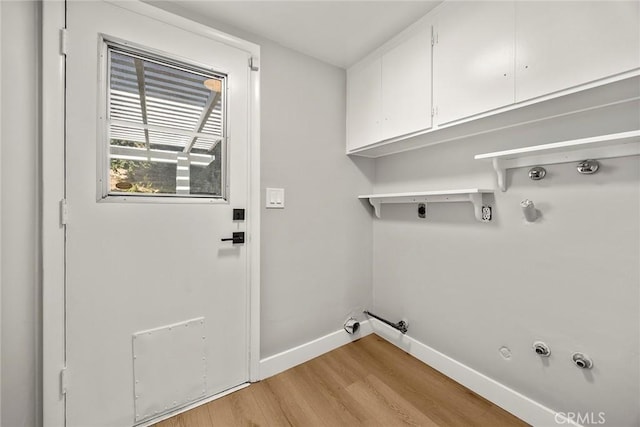 1141 N Palm St, La Habra, CA 90631 - laundry room featuring hookup for a gas dryer, cabinet space, light wood-style floors, and electric dryer hookup